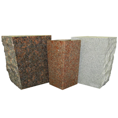 A collection of granite blocks in varying colors, including gray, red, and brown, with rough and polished finishes for memorial customization.